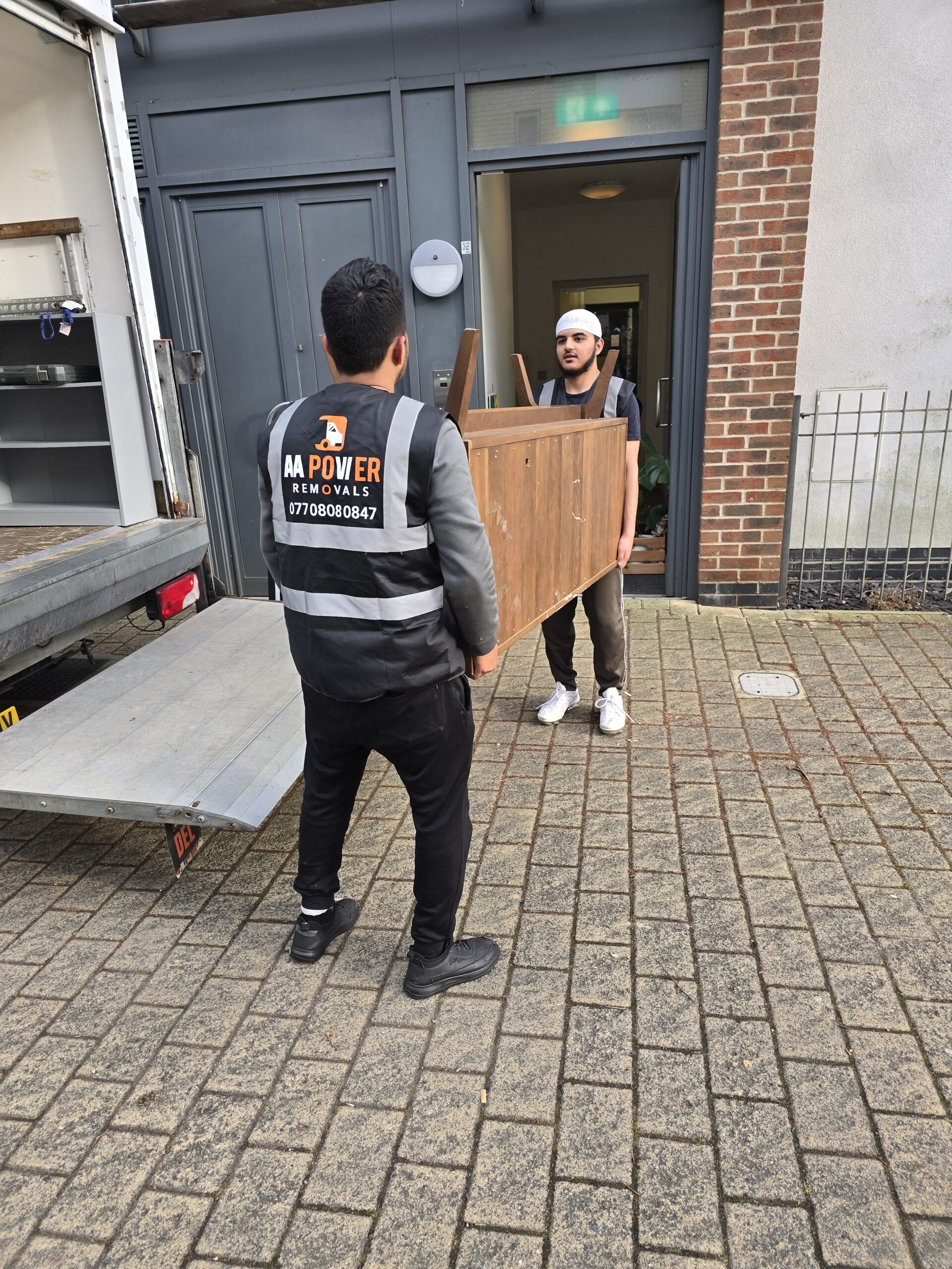 aa power removals team carrying items for move