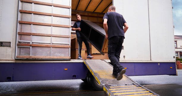 Removal company helping a family move out of their old home